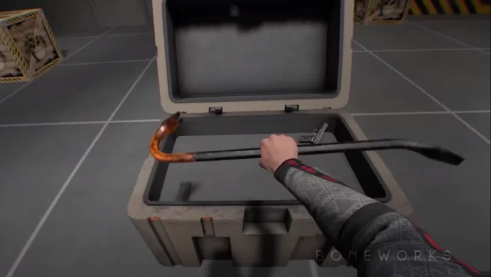 Picking up crowbar from crate
