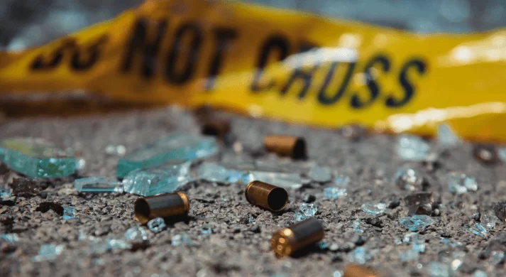 Black Friday Death Count Bullet casings on road